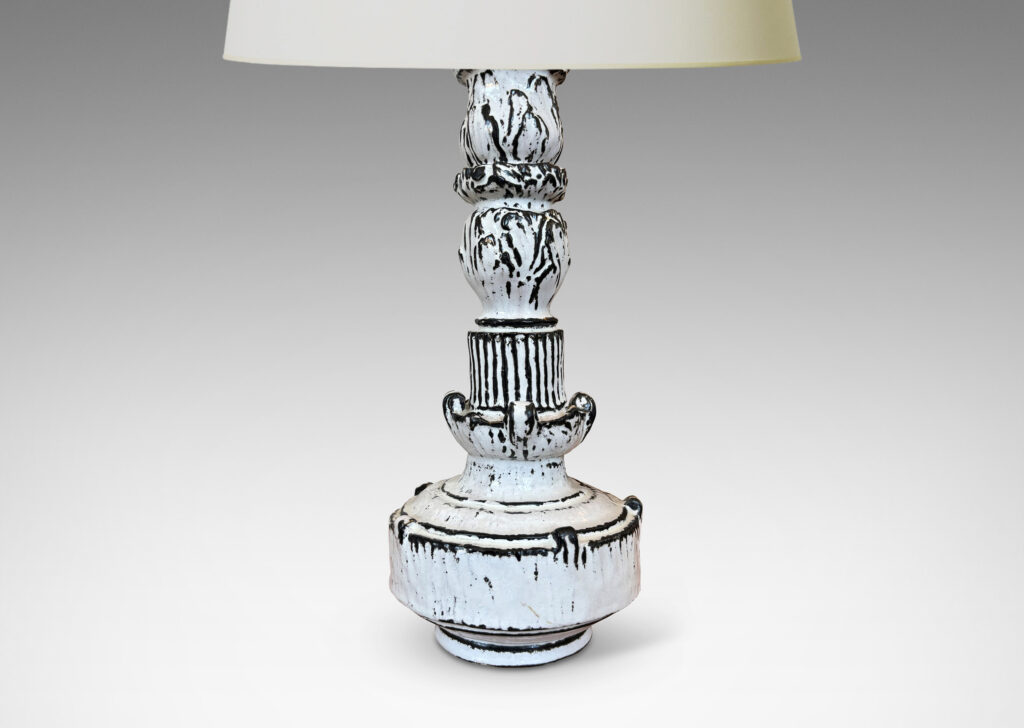Gallery BAC tiered forms carved with balls of acanthus leave, bands of strikes and scrolling forms, wonderfully accentuated in a white-black tin glaze