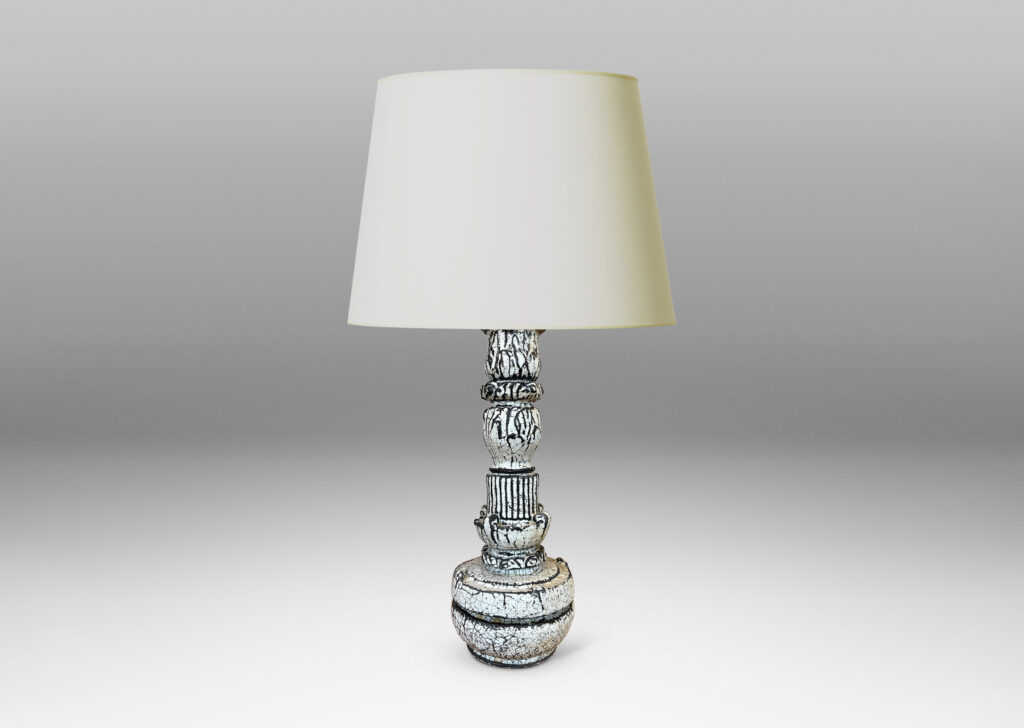Gallery BAC tiered forms carved with balls of acanthus leave, bands of strikes and scrolling forms, wonderfully accentuated in a white-black tin glaze