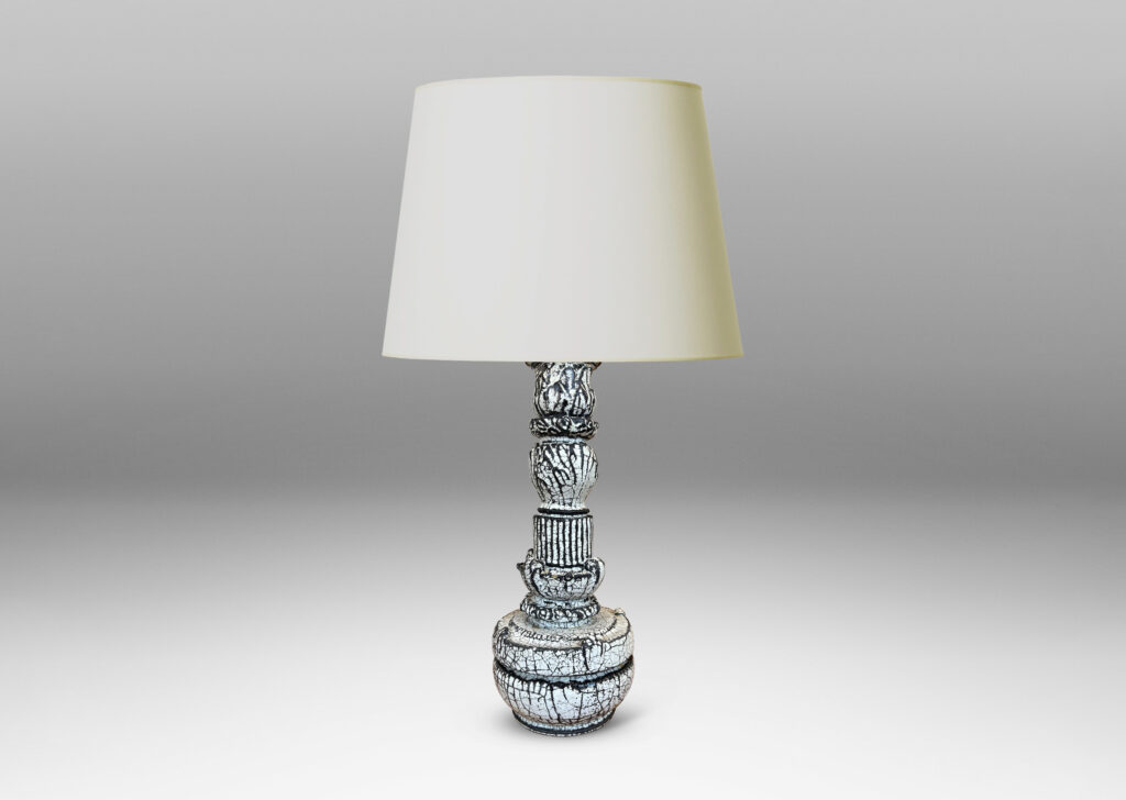 Gallery BAC tiered forms carved with balls of acanthus leave, bands of strikes and scrolling forms, wonderfully accentuated in a white-black tin glaze