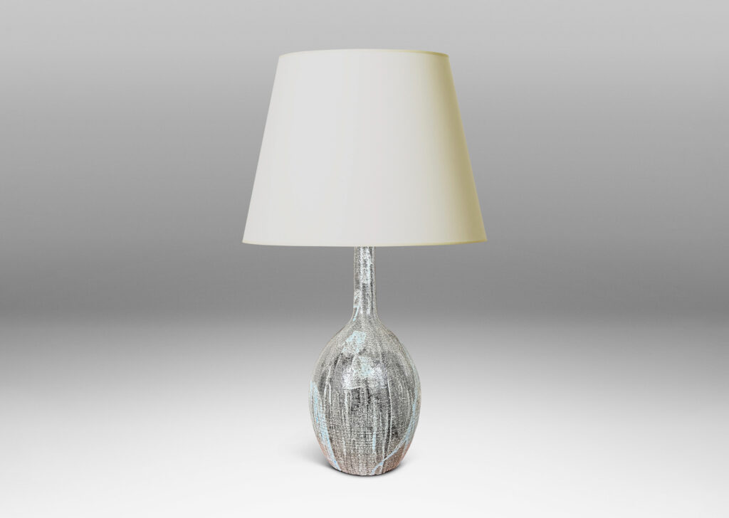 Gallery BAC ovoid form and tall slender neck carved with ridges and glazed in flowing light blue over gray