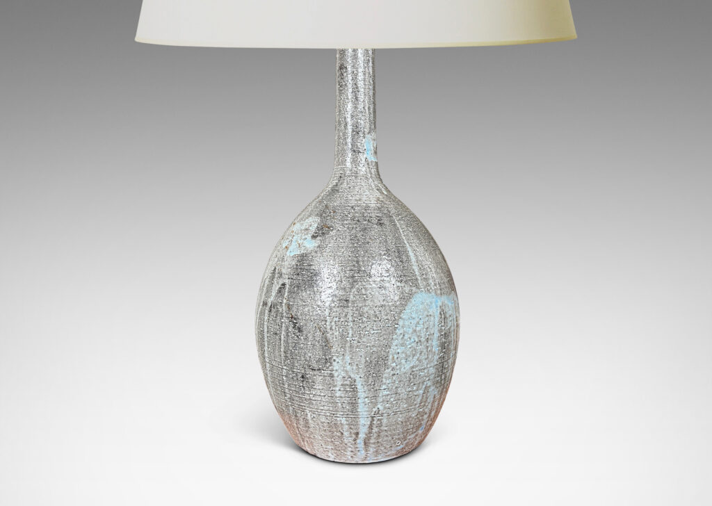 Gallery BAC ovoid form and tall slender neck carved with ridges and glazed in flowing light blue over gray
