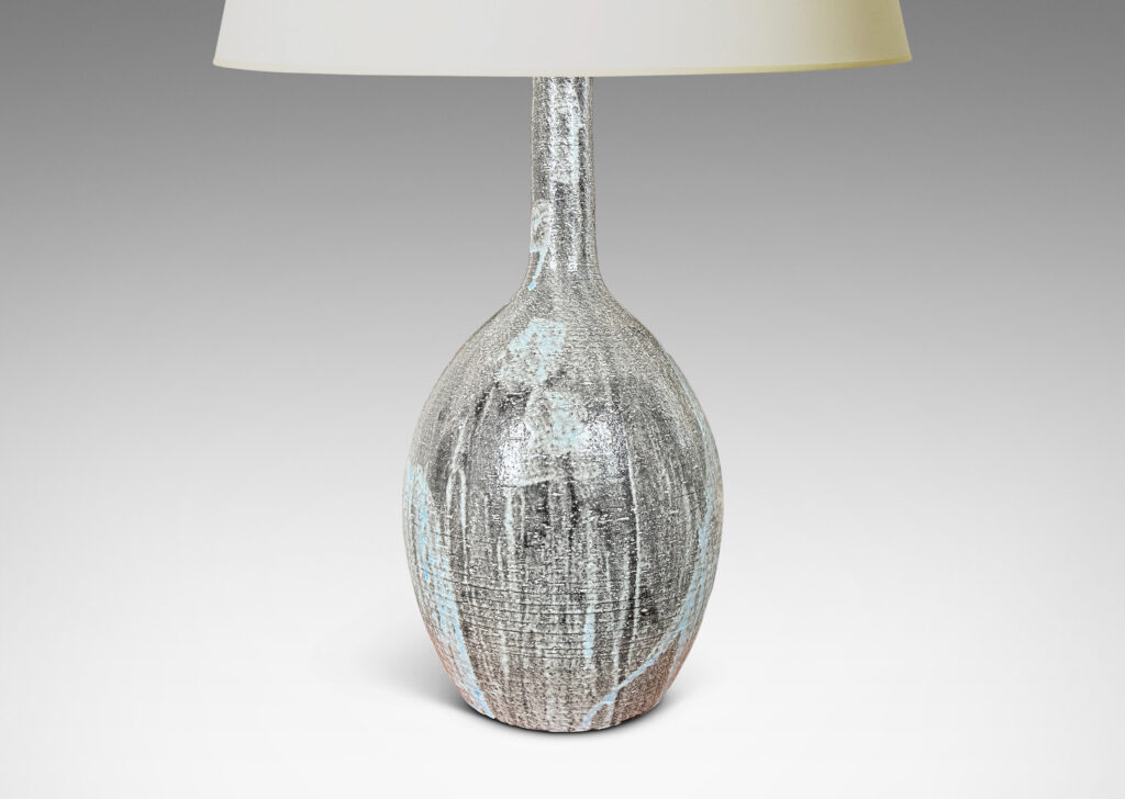 Gallery BAC ovoid form and tall slender neck carved with ridges and glazed in flowing light blue over gray
