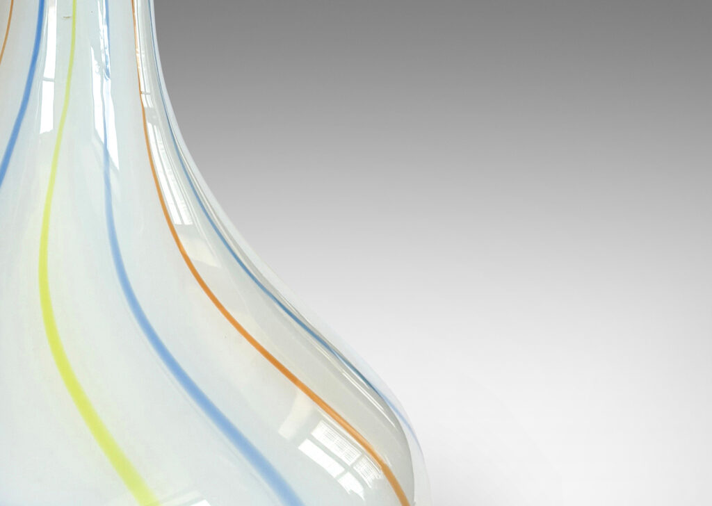 Gallery BAC large hand-blown fig form in white, with gently swirling blue, orange and yellow pinstripes; glass