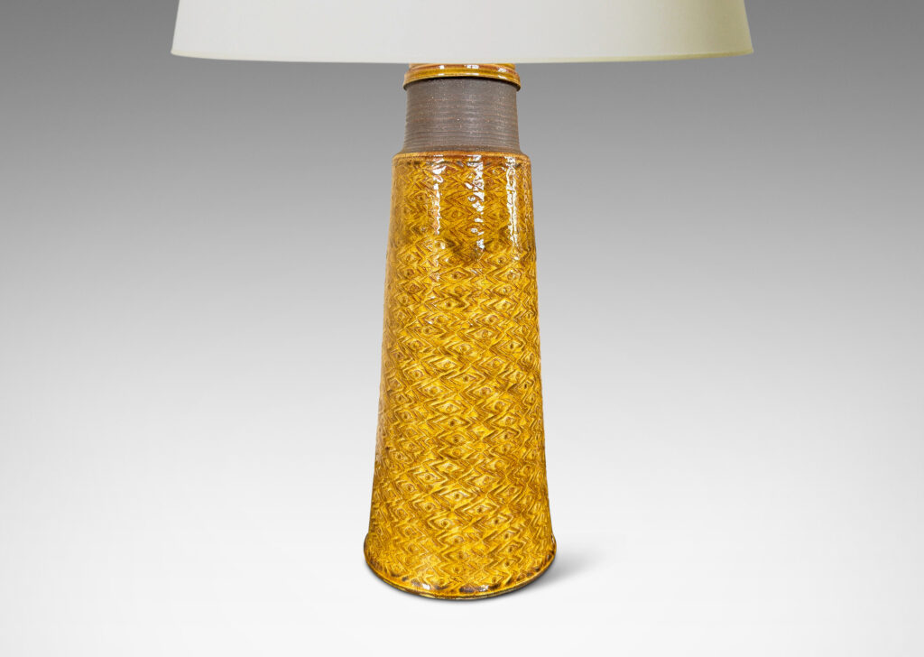 Gallery BAC tall conical form ornamented with a zig-zag / lozenge pattern, glazed in a shiny deep golden honey tone with matte brown ring