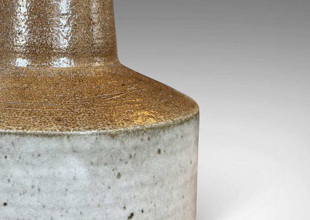 Gallery BAC low rum form with tall conical neck, glazed in brown and light gray