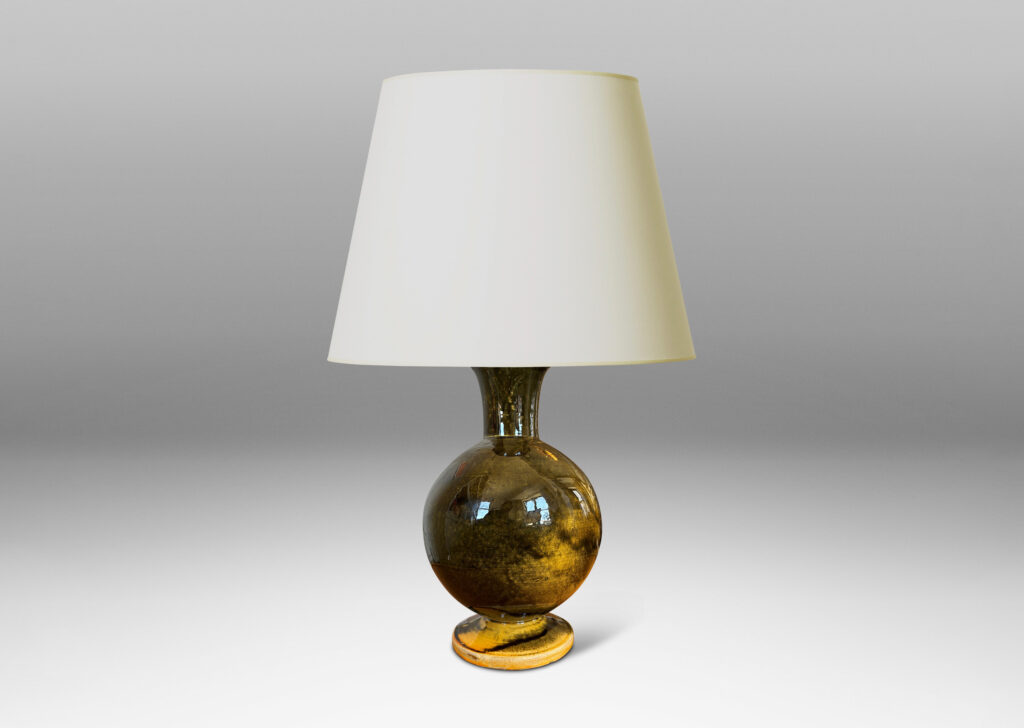 Gallery BAC rationalized baluster form, with spherical body, disk base and flared neck, glazed in yellow-black; earthenware