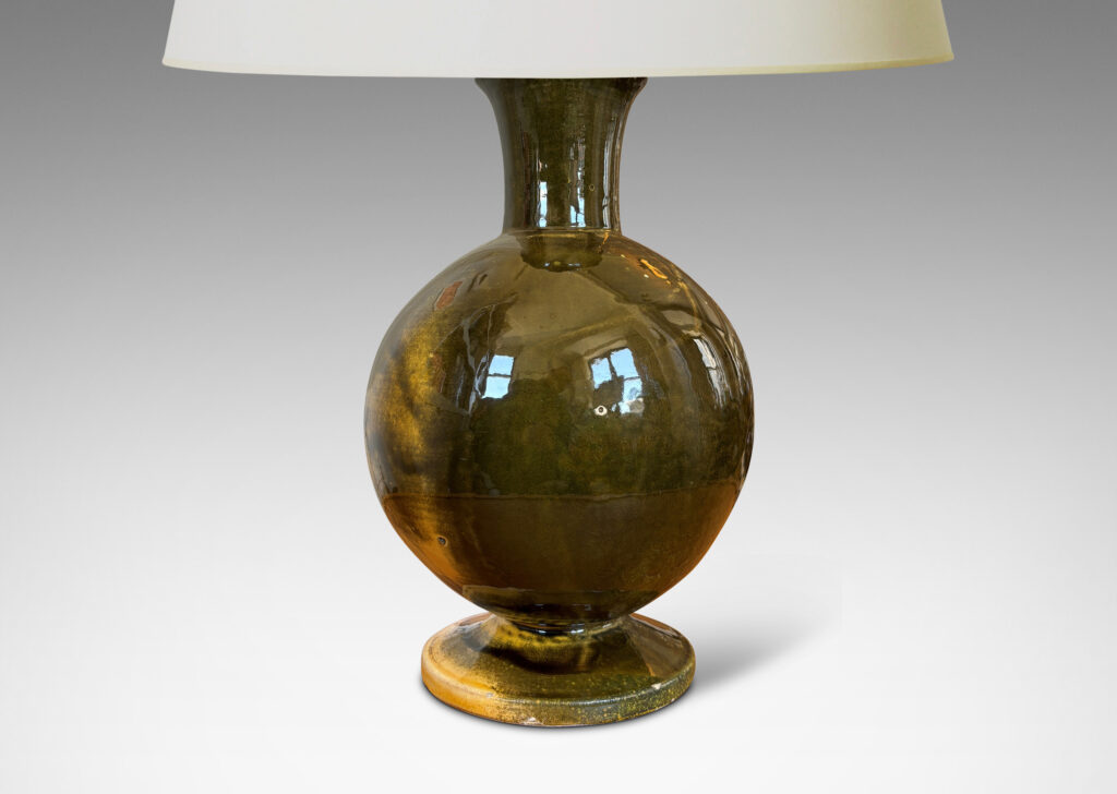 Gallery BAC rationalized baluster form, with spherical body, disk base and flared neck, glazed in yellow-black; earthenware