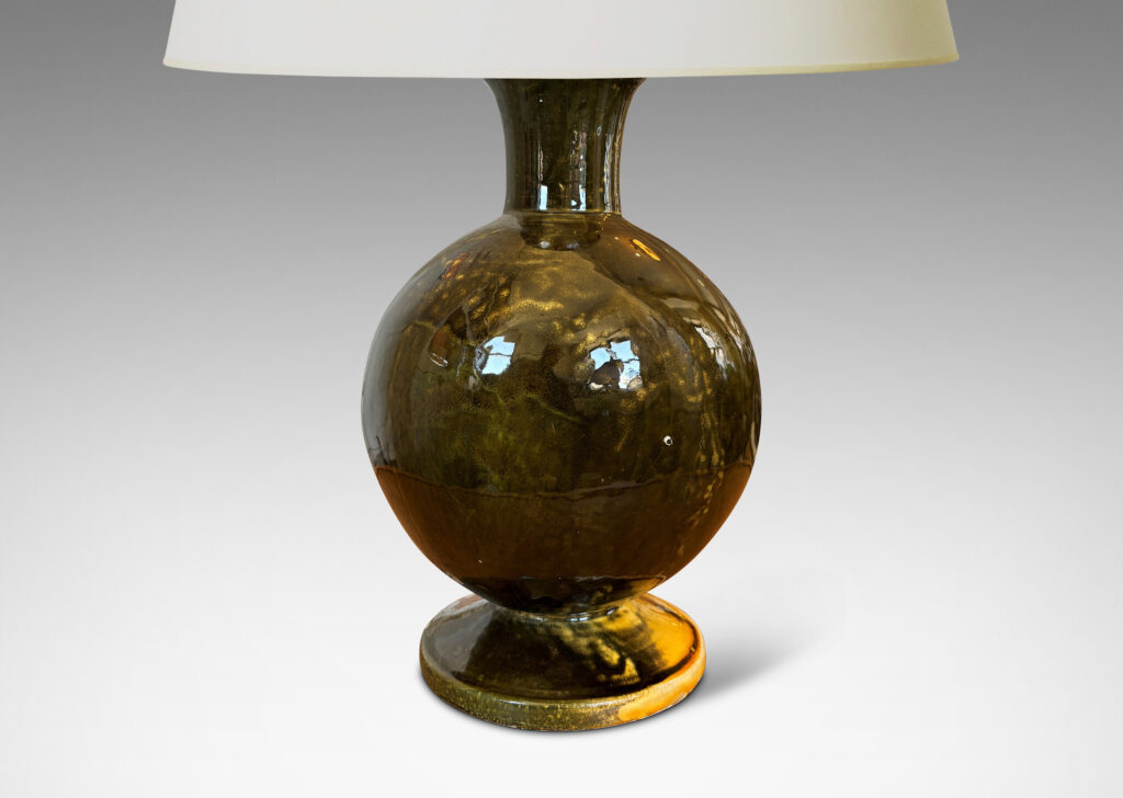 Gallery BAC rationalized baluster form, with spherical body, disk base and flared neck, glazed in yellow-black; earthenware