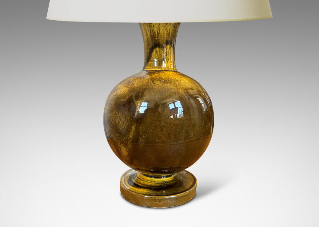 Gallery BAC rationalized baluster form, with spherical body, disk base and flared neck, glazed in yellow-black
