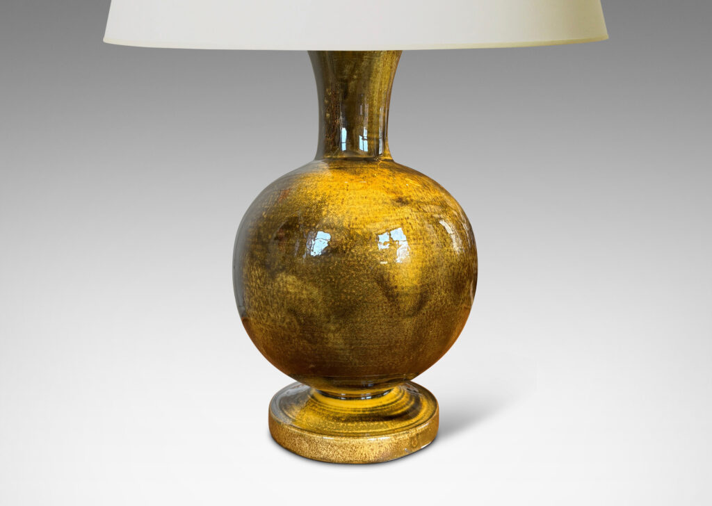 Gallery BAC rationalized baluster form, with spherical body, disk base and flared neck, glazed in yellow-black