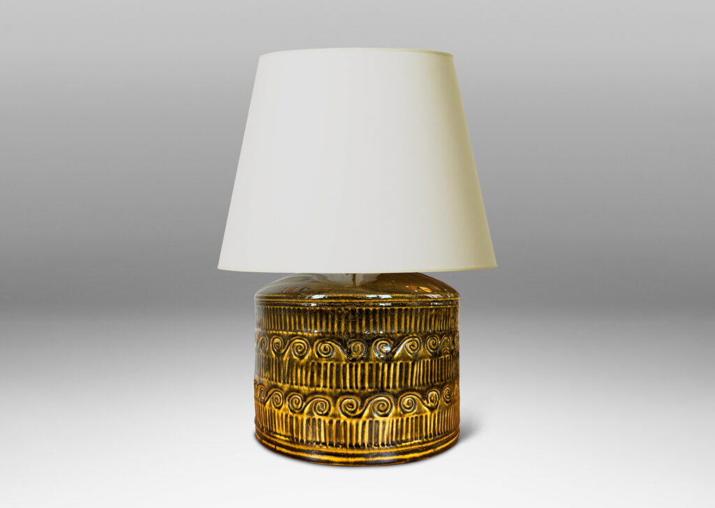 Gallery BAC drum form surrounded in bands of carved strikes and spirals, glazed in yellow-black