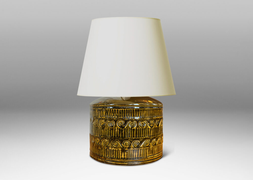 Gallery BAC drum form surrounded in bands of carved strikes and spirals, glazed in yellow-black