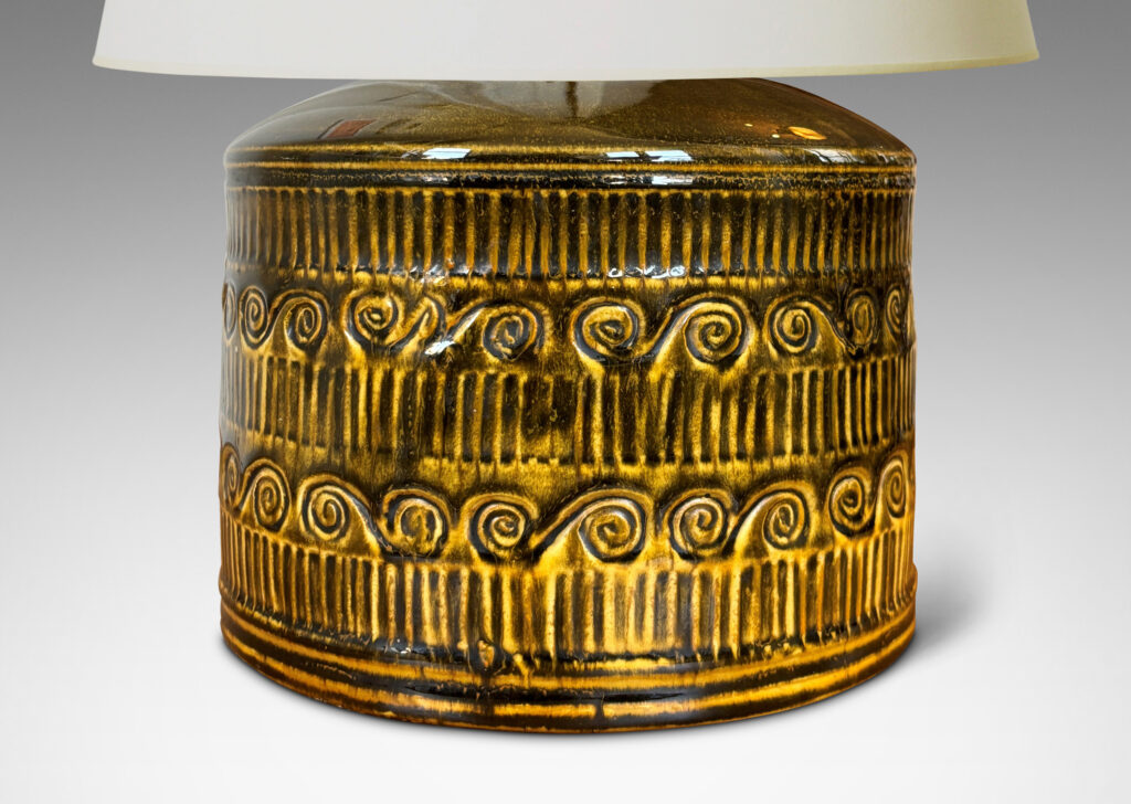 Gallery BAC drum form surrounded in bands of carved strikes and spirals, glazed in yellow-black