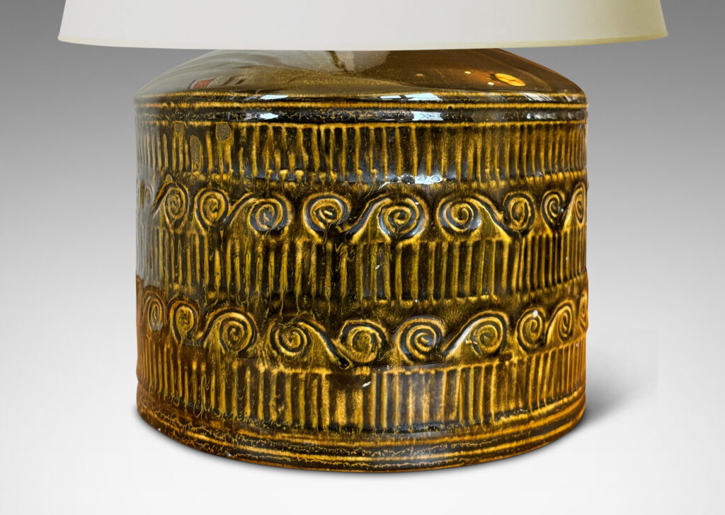 Gallery BAC drum form surrounded in bands of carved strikes and spirals, glazed in yellow-black