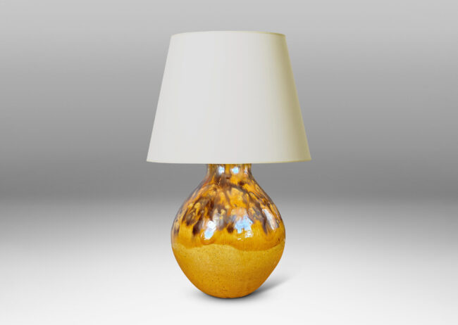 Gallery BAC angled gourd-like form glazed in a golden yellow with flowing brown accents