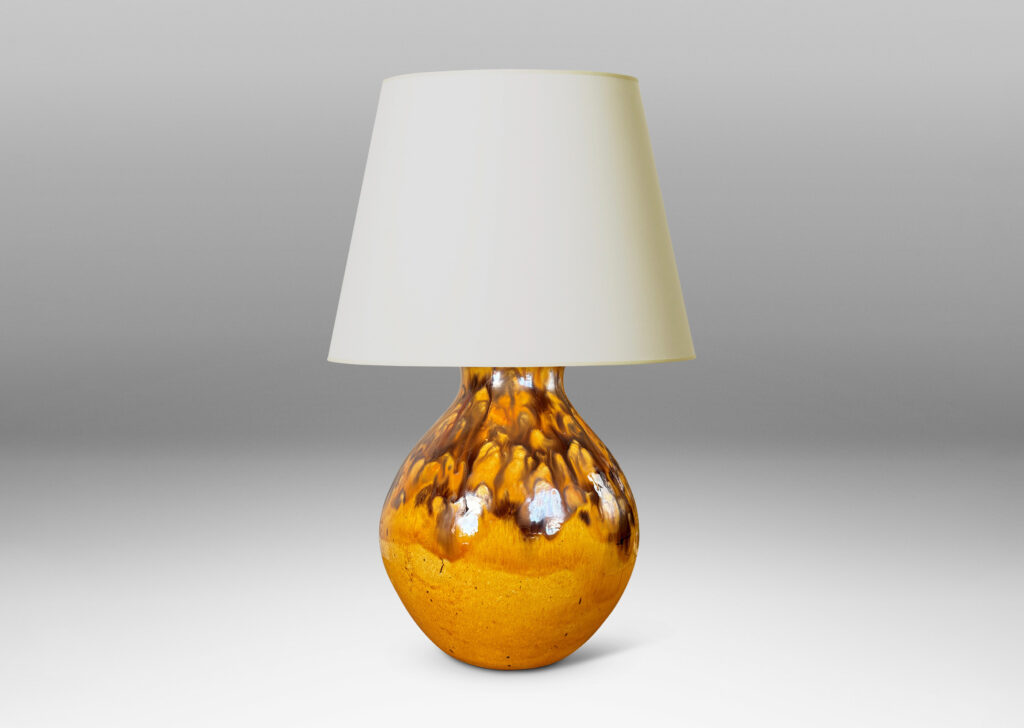 Gallery BAC angled gourd-like form glazed in a golden yellow with flowing brown accents