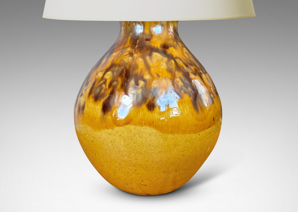 Gallery BAC angled gourd-like form glazed in a golden yellow with flowing brown accents