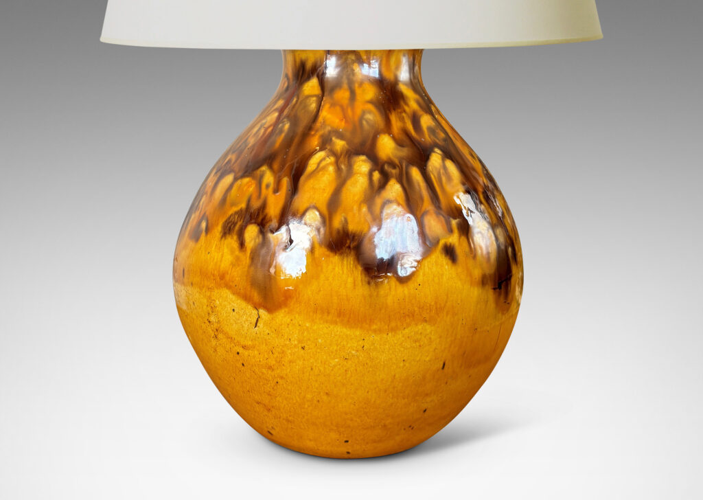 Gallery BAC angled gourd-like form glazed in a golden yellow with flowing brown accents
