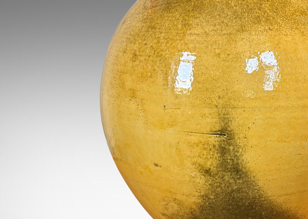 Gallery BAC plump spherical form, glazed in a gloss yellow with black stipple;