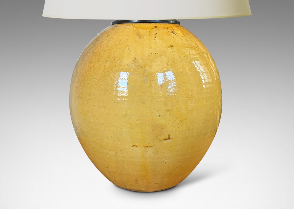Gallery BAC plump spherical form, glazed in a gloss yellow with black stipple;