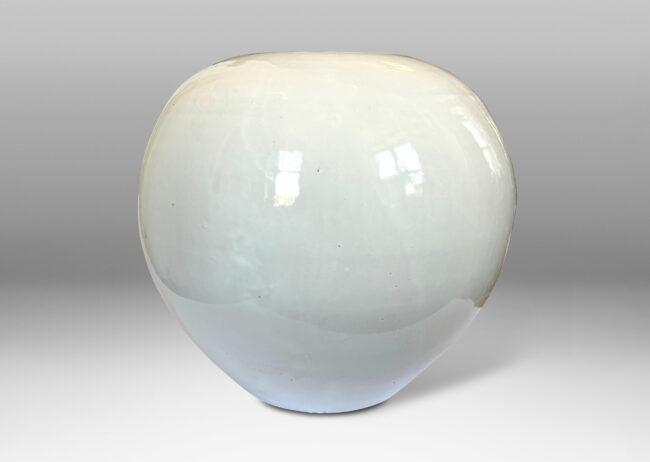 Gallery BAC plump spherical form with unarticulated mouth, glazed in a gloss white