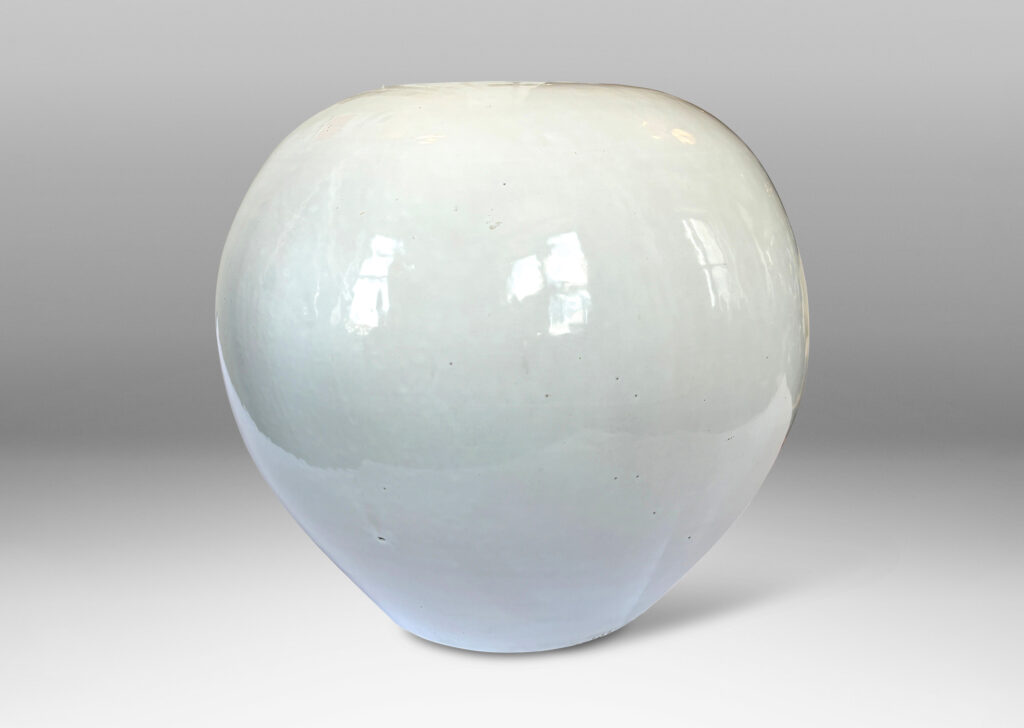 Gallery BAC plump spherical form with unarticulated mouth, glazed in a gloss white