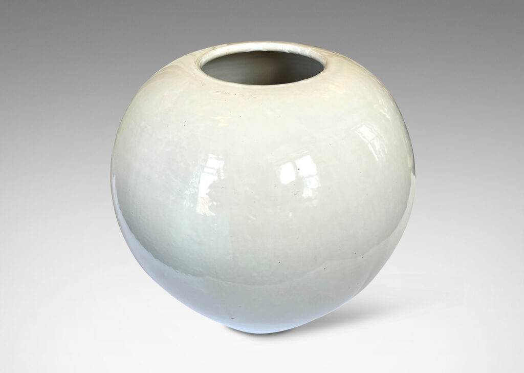 Gallery BAC plump spherical form with unarticulated mouth, glazed in a gloss white