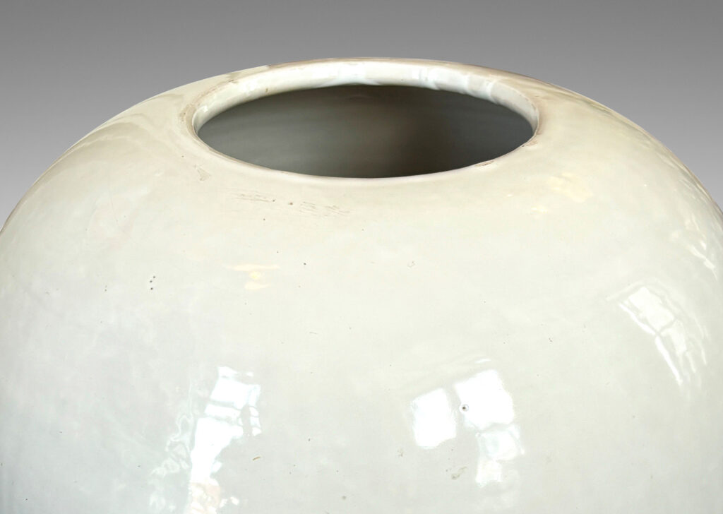 Gallery BAC plump spherical form with unarticulated mouth, glazed in a gloss white