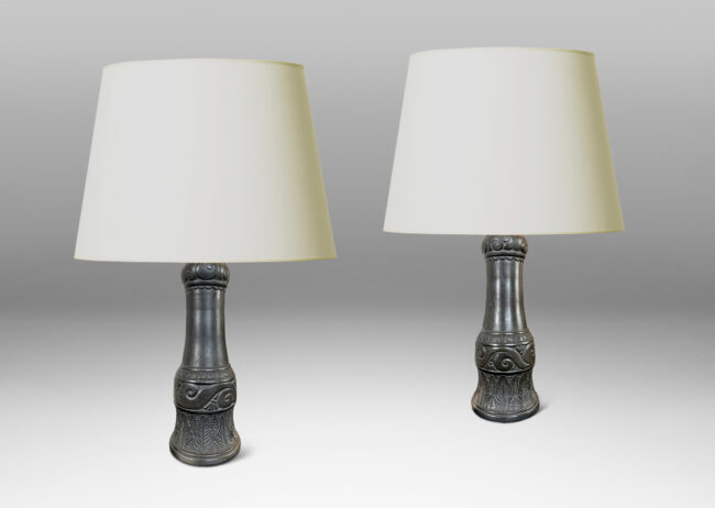 Gallery BAC baluster form ornamented with carved bands of scrolls, leaves, and gadroons, glazed in a matte black