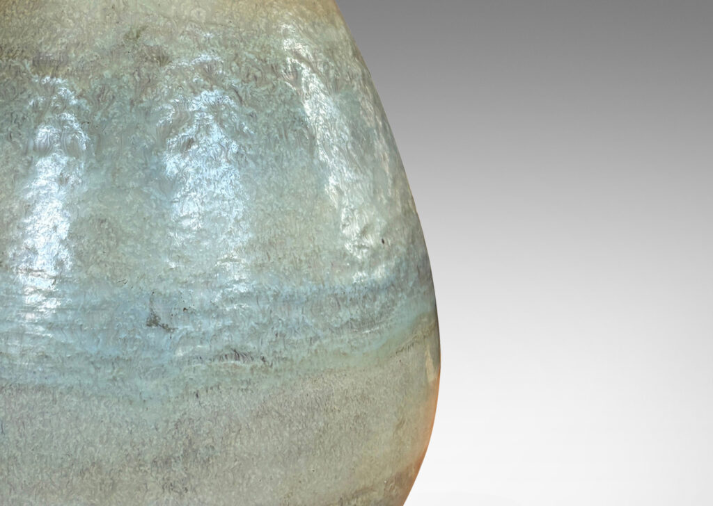 Gallery BAC ovoid form topped with carved spiraling pinstripes, and glazed in subtle bands of green-gray and blue-gray