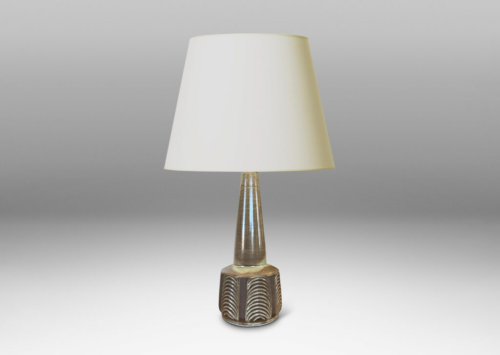 Gallery BAC drum form with carved panels of arc motifs and tall conical stand, glazed in an eggshell finish brown-taupe, with matte brown accents