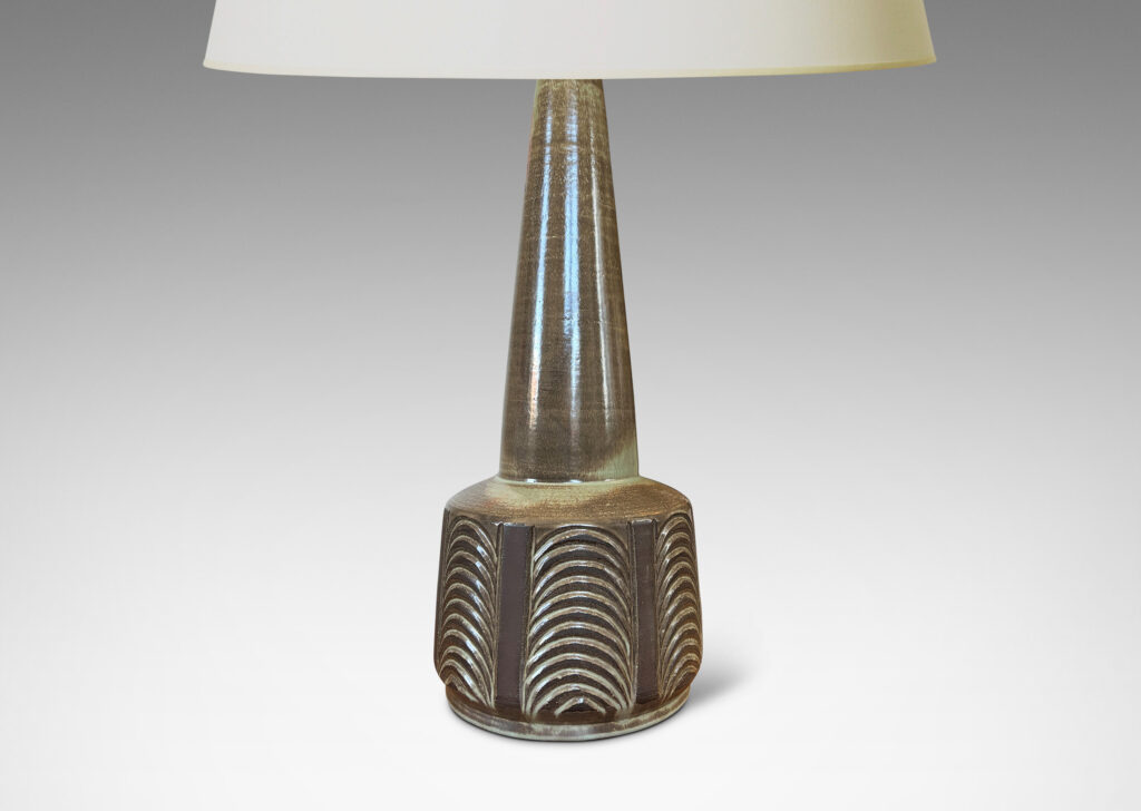 Gallery BAC drum form with carved panels of arc motifs and tall conical stand, glazed in an eggshell finish brown-taupe, with matte brown accents