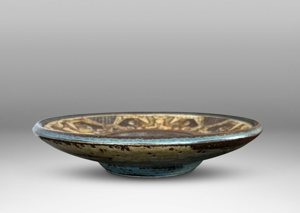Gallery BAC wide rim ornamented with emu-like bird forms, finished in a handsomely rendered beige and brown “Sung” glaze