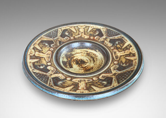 Gallery BAC wide rim ornamented with emu-like bird forms, finished in a handsomely rendered beige and brown “Sung” glaze