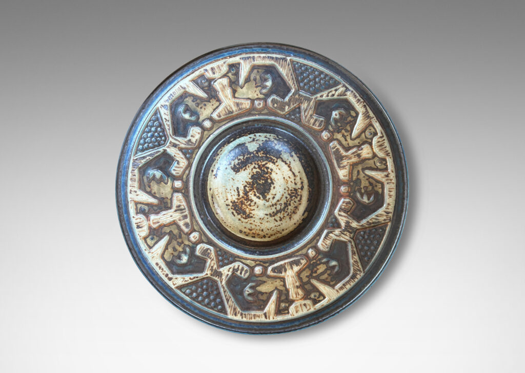 Gallery BAC wide rim ornamented with emu-like bird forms, finished in a handsomely rendered beige and brown “Sung” glaze