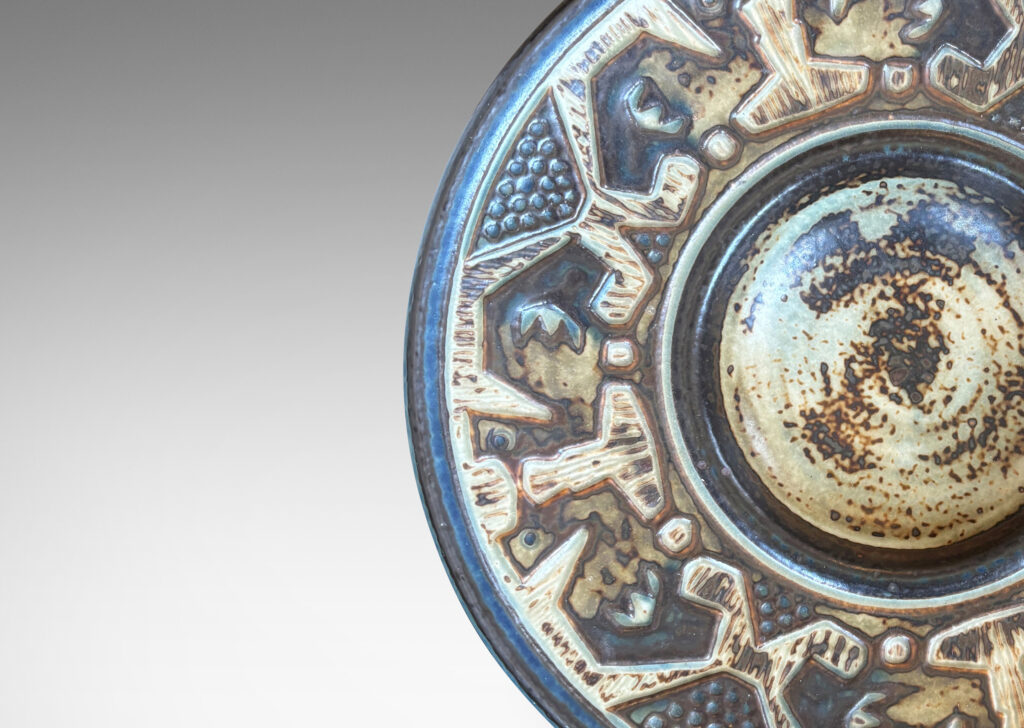 Gallery BAC wide rim ornamented with emu-like bird forms, finished in a handsomely rendered beige and brown “Sung” glaze