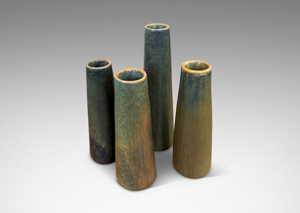 Gallery BAC tapered cylindrical forms in a mottled green-tan glazed