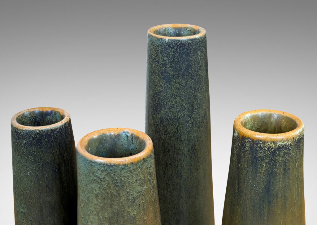 Gallery BAC tapered cylindrical forms in a mottled green-tan glazed