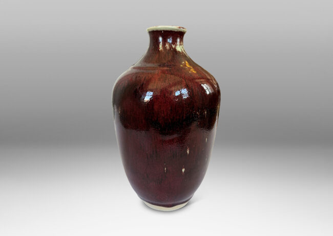 Gallery BAC tapered form glazed in a deep burgundy oxblood with pale gray accents