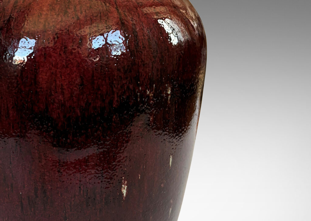 Gallery BAC tapered form glazed in a deep burgundy oxblood with pale gray accents