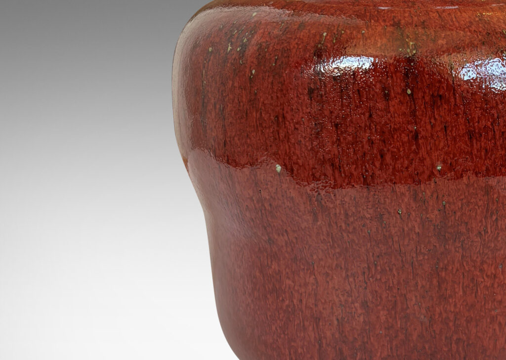 Gallery BAC swelling gourd form with wide mouth, glazed in a deep burgundy oxblood with pale gray accents