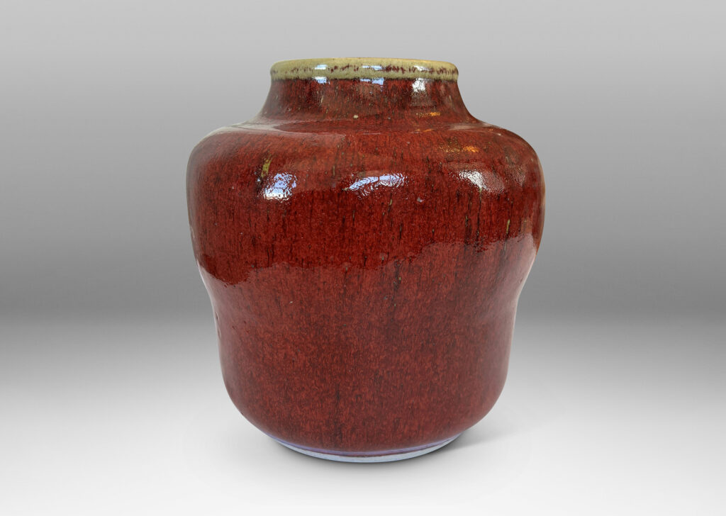 Gallery BAC swelling gourd form with wide mouth, glazed in a deep burgundy oxblood with pale gray accents