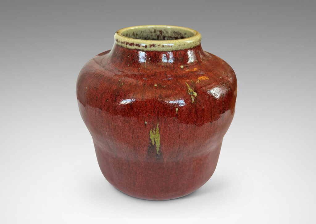 Gallery BAC swelling gourd form with wide mouth, glazed in a deep burgundy oxblood with pale gray accents