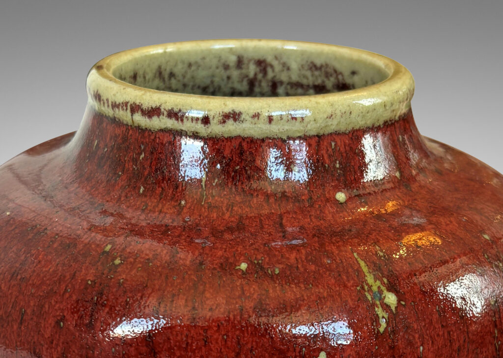 Gallery BAC swelling gourd form with wide mouth, glazed in a deep burgundy oxblood with pale gray accents