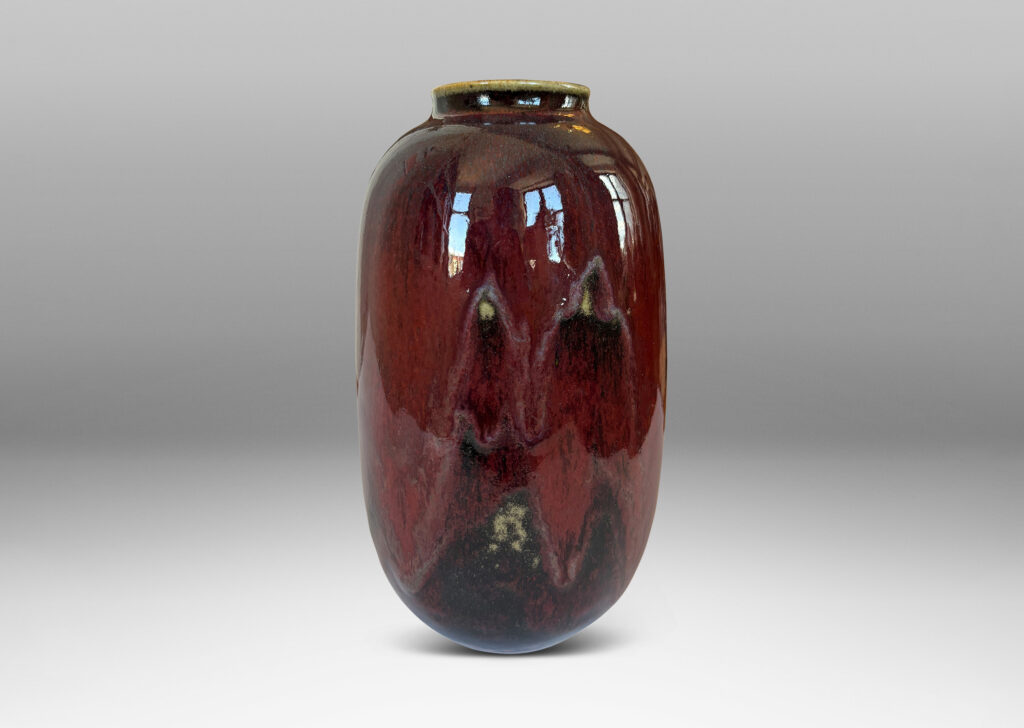 Gallery BAC large ovoid form with wide mouth, glazed in a deep burgundy oxblood with pale and dark gray accents