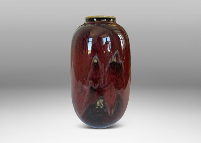 Gallery BAC large ovoid form with wide mouth, glazed in a deep burgundy oxblood with pale and dark gray accents