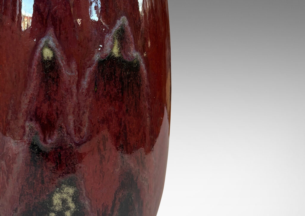 Gallery BAC large ovoid form with wide mouth, glazed in a deep burgundy oxblood with pale and dark gray accents