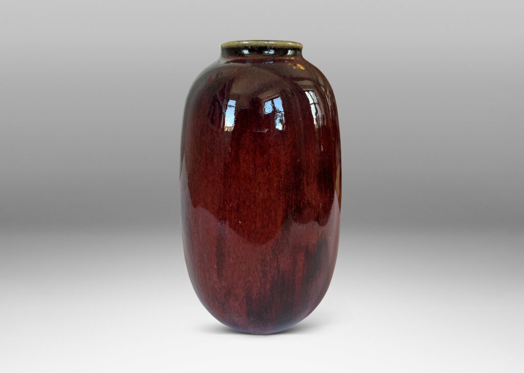 Gallery BAC large ovoid form with wide mouth, glazed in a deep burgundy oxblood with pale and dark gray accents