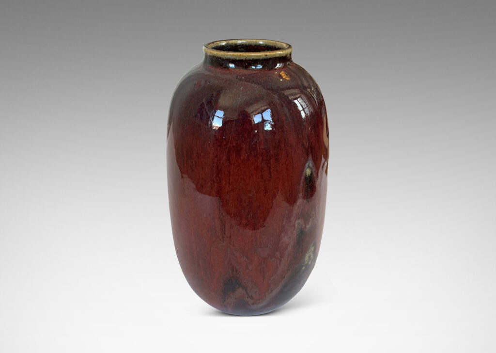 Gallery BAC large ovoid form with wide mouth, glazed in a deep burgundy oxblood with pale and dark gray accents