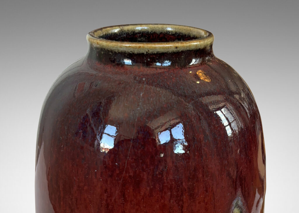 Gallery BAC large ovoid form with wide mouth, glazed in a deep burgundy oxblood with pale and dark gray accents